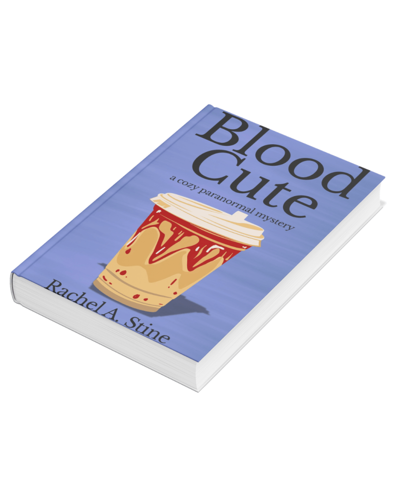 Cover for my book Blood Cute. It shows the title Blood Cute a cozy paranormal mystery with a blended coffee drink and red dripping topping in the coffee. Under that is my name Rachel A. Stine